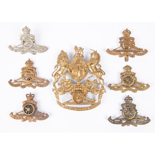 355 - A post 1902 Royal Artillery officers helmet plate (no gilt remaining); and six Artillery cap badges,... 