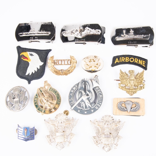 385 - A quantity of post WWII US Army and Airforce insignia, cap badges, buckles etc. All in VGC  £45-60