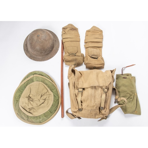 397 - A WWII steel helmet, 2 webbing bren pouches; a webbing small pack, 2 belts, a breech cover and 2 oth... 