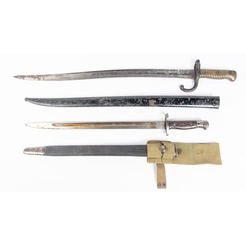 447 - A Chassepot bayonet dated 1874, in its scabbard (blade well pitted); a 1907 bayonet (scabbard well w... 