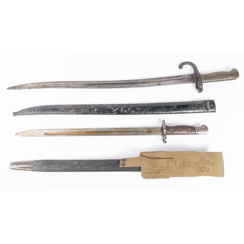 447 - A Chassepot bayonet dated 1874, in its scabbard (blade well pitted); a 1907 bayonet (scabbard well w... 