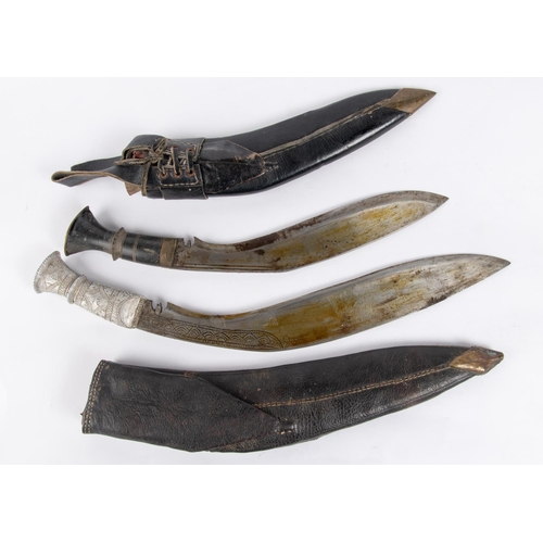 452 - A Gurkha kukri, with horn hilt and black leather sheath, also skinning knives; another similar with ... 