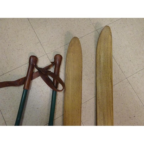 18 - A good pair of vintage wooden skis, complete with pair of sticks. GC £30-40