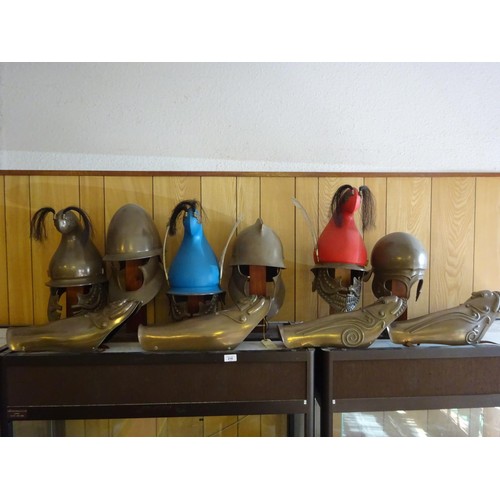 216 - Re-enactment ancient Greek or Persian fibreglass armour, comprising 5 helmets and 2 pairs of leg def... 