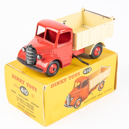 319 - Dinky Toys Bedford End Tipper (410). Red chassis cab with cream body and red wheels. Boxed, some wea... 