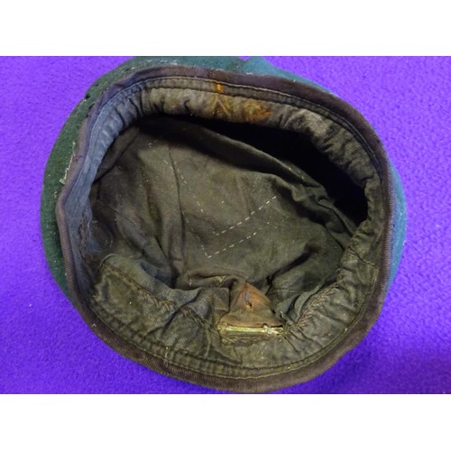 389 - 2 WWII officers' khaki SD caps, Royal Fusiliers and Royal Artillery; 2 khaki tam o' shanters; 2 Cana... 