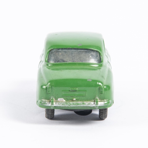 281 - Corgi Toys Rover 90 Saloon (204M). An early mechanical in dark green with a working friction powered... 