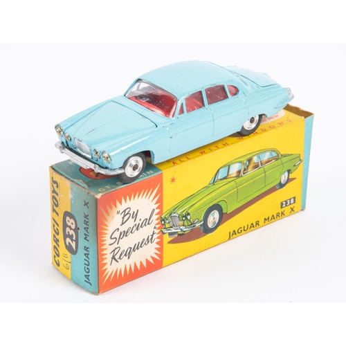 283 - A Corgi Toys Jaguar Mark X (238). In light blue with red interior and dished spun wheels. Boxed, min... 