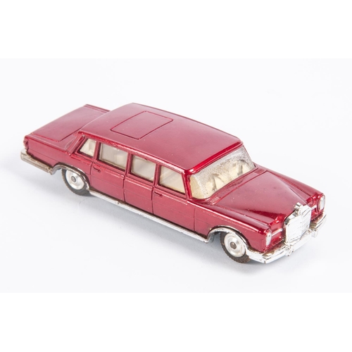 284 - Corgi Toys Mercedes Benz 600 Pullman (247). A lighter red example with cream interior, complete with... 