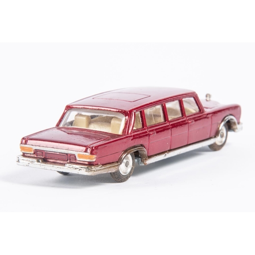 284 - Corgi Toys Mercedes Benz 600 Pullman (247). A lighter red example with cream interior, complete with... 