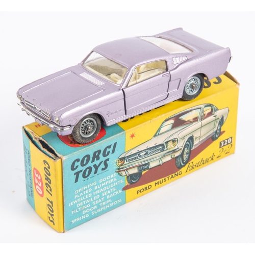 285 - Corgi Toys Ford Mustang Fastback 2+2 (320). In metallic lilac with cream interior, example with spok... 