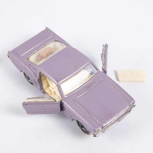 285 - Corgi Toys Ford Mustang Fastback 2+2 (320). In metallic lilac with cream interior, example with spok... 