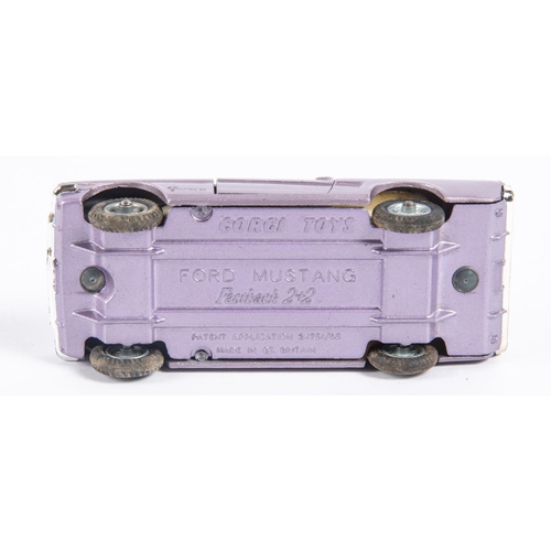 285 - Corgi Toys Ford Mustang Fastback 2+2 (320). In metallic lilac with cream interior, example with spok... 