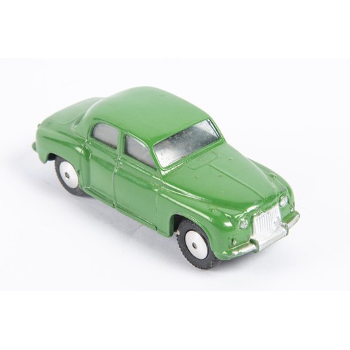 281 - Corgi Toys Rover 90 Saloon (204M). An early mechanical in dark green with a working friction powered... 