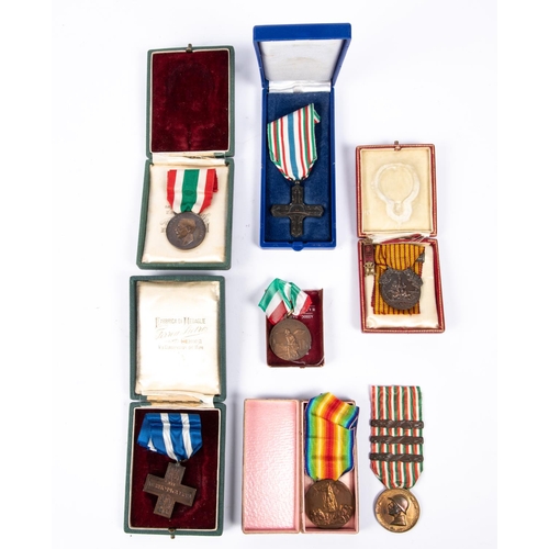 158 - Seven Italian war medals, including 1914-18 Victory medal, Merito di Guerra cross, 1915-18 war medal... 