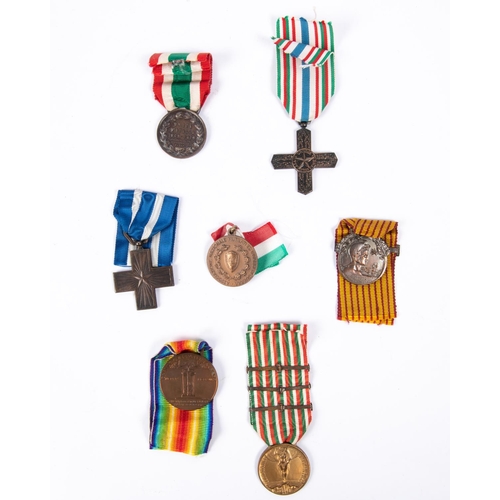 158 - Seven Italian war medals, including 1914-18 Victory medal, Merito di Guerra cross, 1915-18 war medal... 