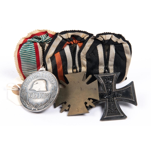 191 - A WWI German medal trio: 1914 Iron Cross 2nd class, 1914-1918 Honour Cross with swords, and Hungaria... 