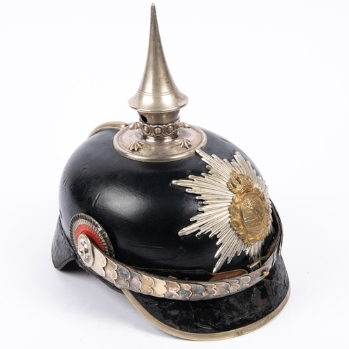 199 - An Imperial German Saxony officials pickelhaube, with star plate and white metal mounts, including s... 