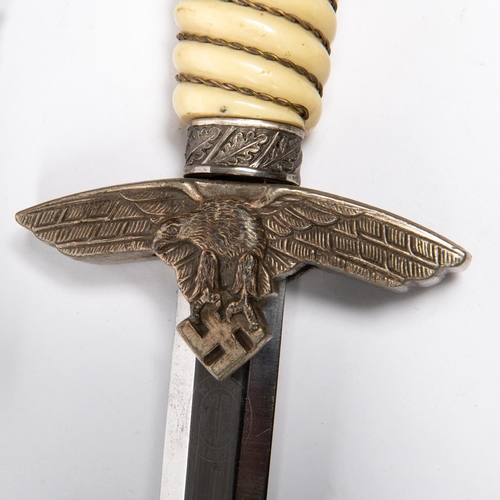 204 - A Third Reich 2nd pattern Luftwaffe officer’s dagger, with faint Weyersberg mark, in its sheath with... 