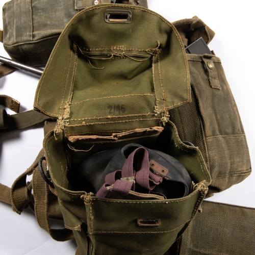 238 - A set of WWII infantrymans 1937 webbing, comprising waistbelt, cross straps, ammunition pouches with... 