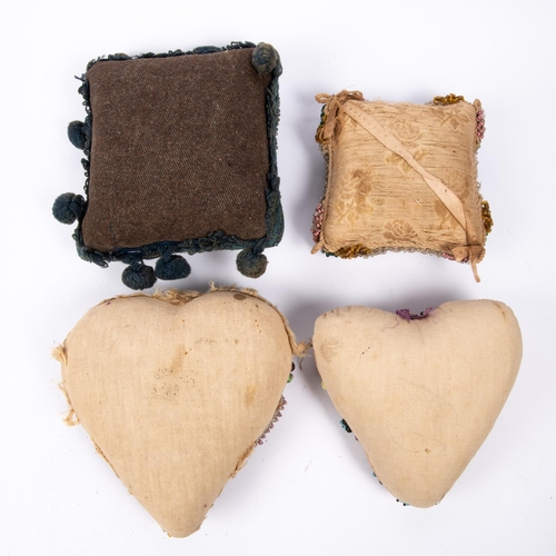 24 - Two early 20th century heart shaped “sweetheart” pin cushions, one incorporating the badge of the Wa... 