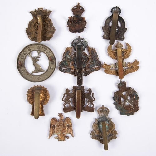 257 - Eleven Yeomanry cap badges: Yorkshire Dragoons, Duke of Lancaster's, Lanarkshire, large brass Derbys... 