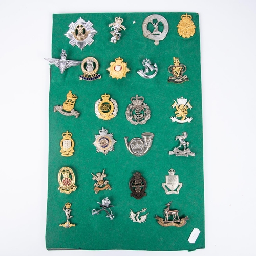 265 - Twenty three various cap badges, including silver coloured Ryl West Kent officers, the Scottish Yeom... 