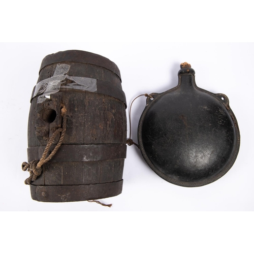 27 - A 19th century discus shaped leather water bottle, with two integral loops for suspension and short ... 