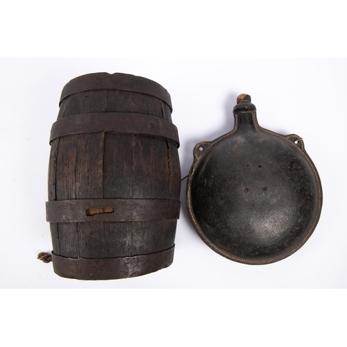 27 - A 19th century discus shaped leather water bottle, with two integral loops for suspension and short ... 