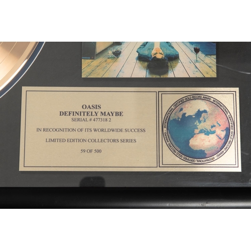 3 - A framed 'gold disc' of the band Oasis' album 'Definitely Maybe'. Framing includes; Gold vinyl LP, C... 