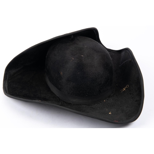 324 - A 19th century tricorn hat, with silk edging to the brim and gold bullion lace stripe to one side wi... 