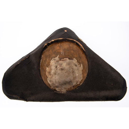 324 - A 19th century tricorn hat, with silk edging to the brim and gold bullion lace stripe to one side wi... 