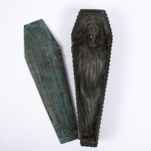 35 - A cast bronze model of a heavily studded coffin  with hinged studded lid containing the body of Char... 