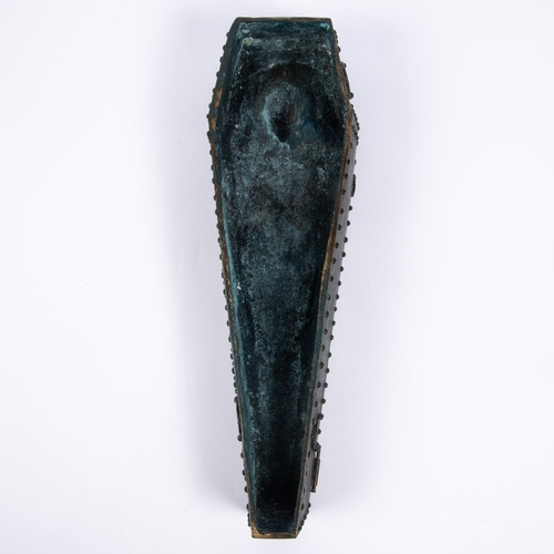 35 - A cast bronze model of a heavily studded coffin  with hinged studded lid containing the body of Char... 