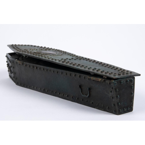 35 - A cast bronze model of a heavily studded coffin  with hinged studded lid containing the body of Char... 