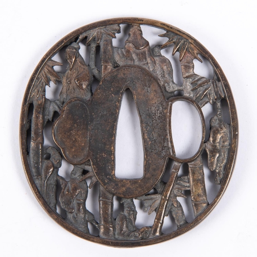 363 - A Japanese brass tsuba, pierced and embossed with figures and bamboo and with 2 line signature. GC £... 