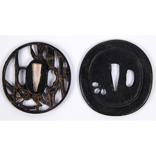 364 - A Japanese cast brass tsuba, pierced and embossed with reeds and bamboo; and a plain blackened cast ... 