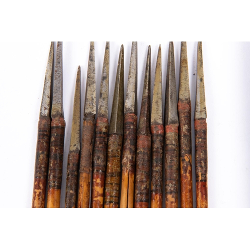 382 - A set of 12 18th century Indian crossbow bolts, the iron heads having rectangular section bodkin poi... 