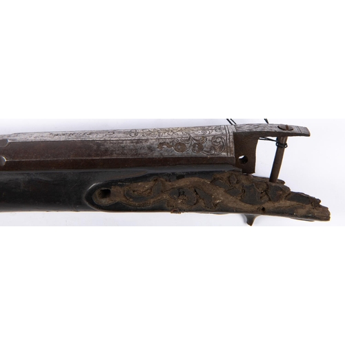 407 - The barrel, fore end and some mounts from a late 17th century flintlock carbine, 4 stage barrel 29½”... 