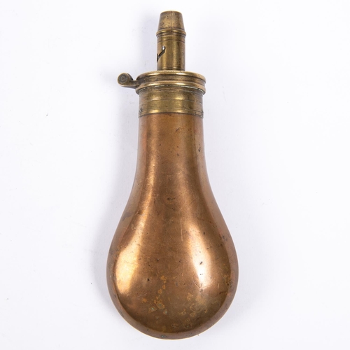 421 - A plain copper powder flask 6½