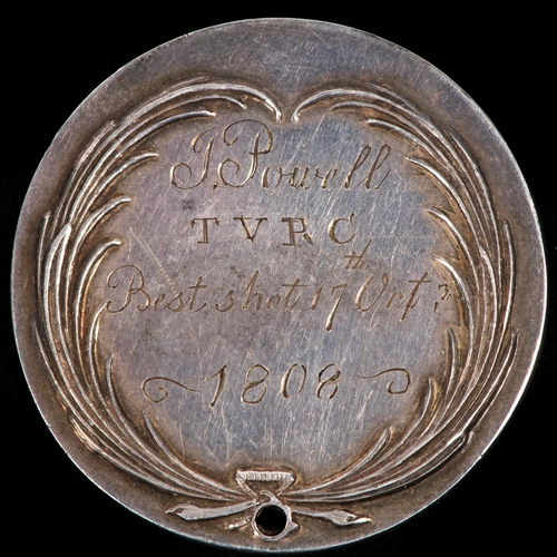 85 - A Georgian silver shooting award, 1808, obverse device of crowned crossed cannon and flintlock muske... 