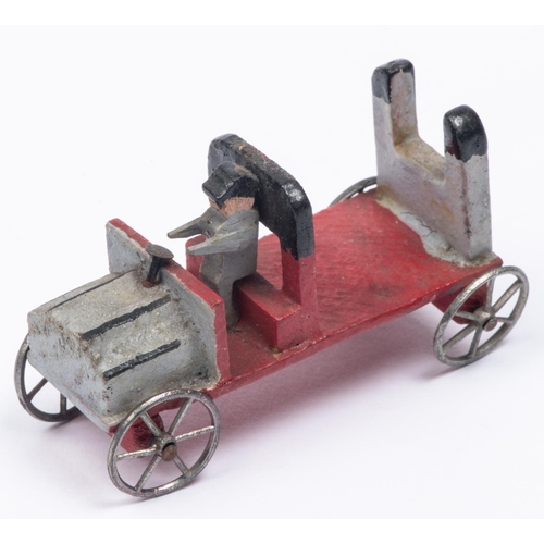 179 - A rare early Edwardian wooden Penny Toy style car. In light grey and red, with driver and fitted wit... 