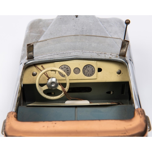 206 - 2 Italian produced plated tinplate clockwork musical cars. A 1950's Buick style 2 seat open tourer, ... 