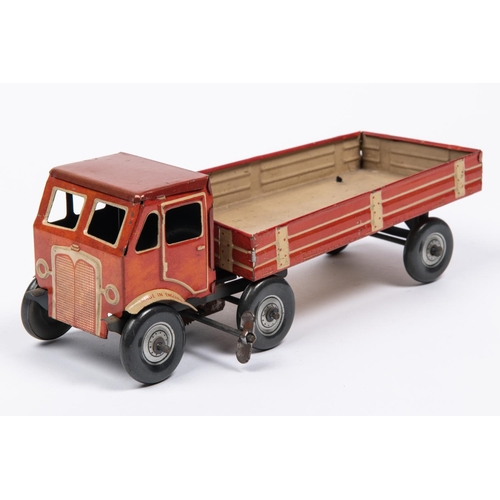 211 - A Mettoy tinplate clockwork articulated lorry. The 4 wheeled tractor unit is in the style of AEC, wi... 