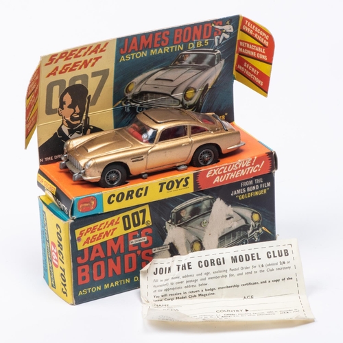 382 - A Corgi Toys James Bond Aston Martin DB5 (261). First version in metallic gold with passenger. Boxed... 