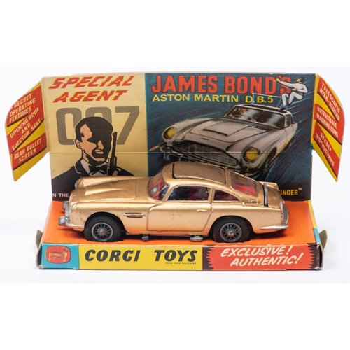 382 - A Corgi Toys James Bond Aston Martin DB5 (261). First version in metallic gold with passenger. Boxed... 