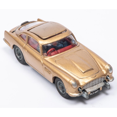 382 - A Corgi Toys James Bond Aston Martin DB5 (261). First version in metallic gold with passenger. Boxed... 