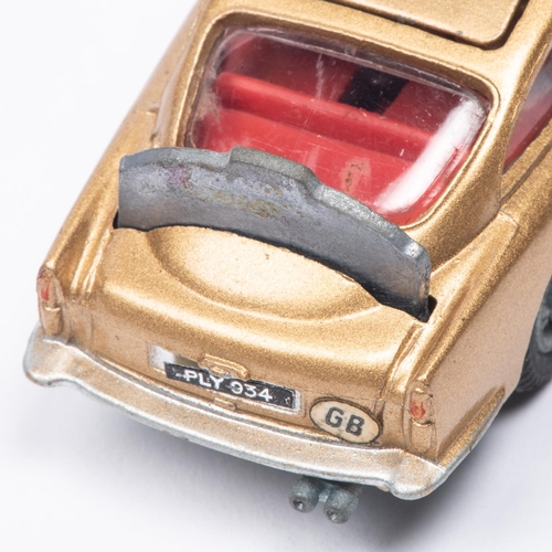 382 - A Corgi Toys James Bond Aston Martin DB5 (261). First version in metallic gold with passenger. Boxed... 