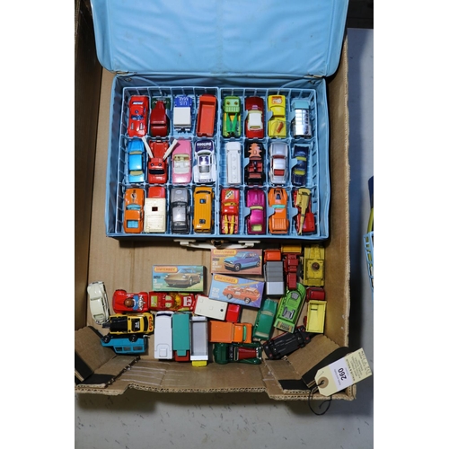 260 - 2 Matchbox Carry Cases. One containing 48 examples, cars, trucks Ambulances, farm vehicles, fire eng... 