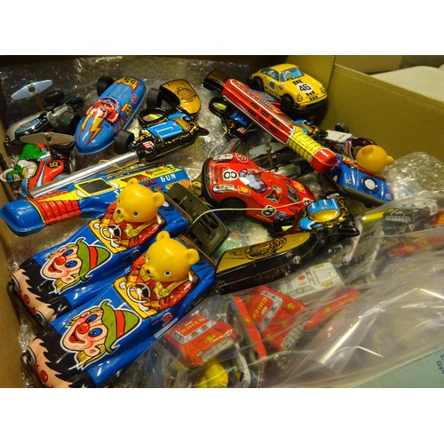 202 - A quantity of Small Tinplate Vehicles and other items. Vehicles include Police, Fire, Ambulance, Tax... 